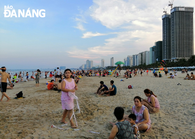 a local beach crowded with beach goers in the afternoon of 14 may