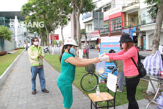 a woman receiving a free meal