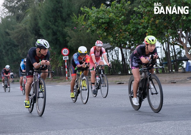 cyclists are seen on nguyen tat thanh street