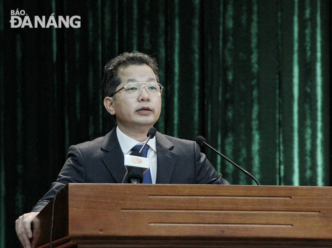 delivering a speech at the conference
