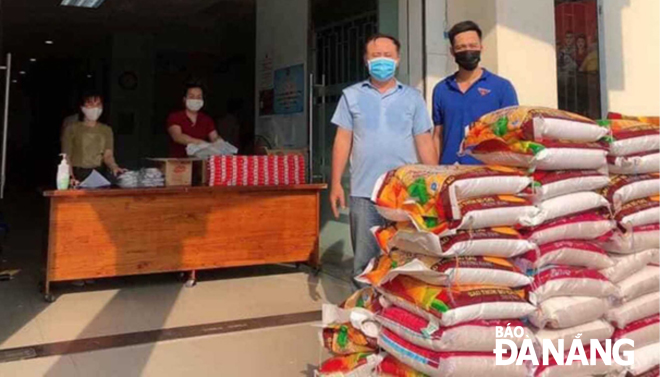 offering rice to local low income families