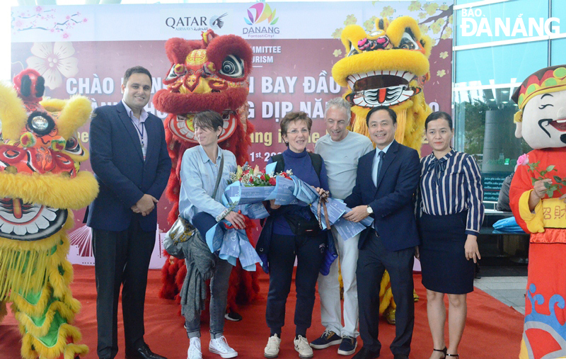 presenting flowers to first international air passengers
